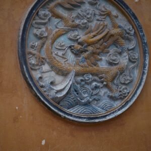 a metal plate with a dragon on it