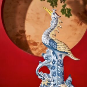 A blue and white vase sitting on top of a table